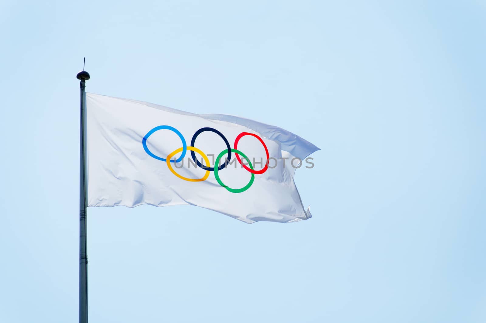 LONDON, UK - CIRCA JULY 2012: Olympic flag against blue sky background during London 2012 Olympic Games.
