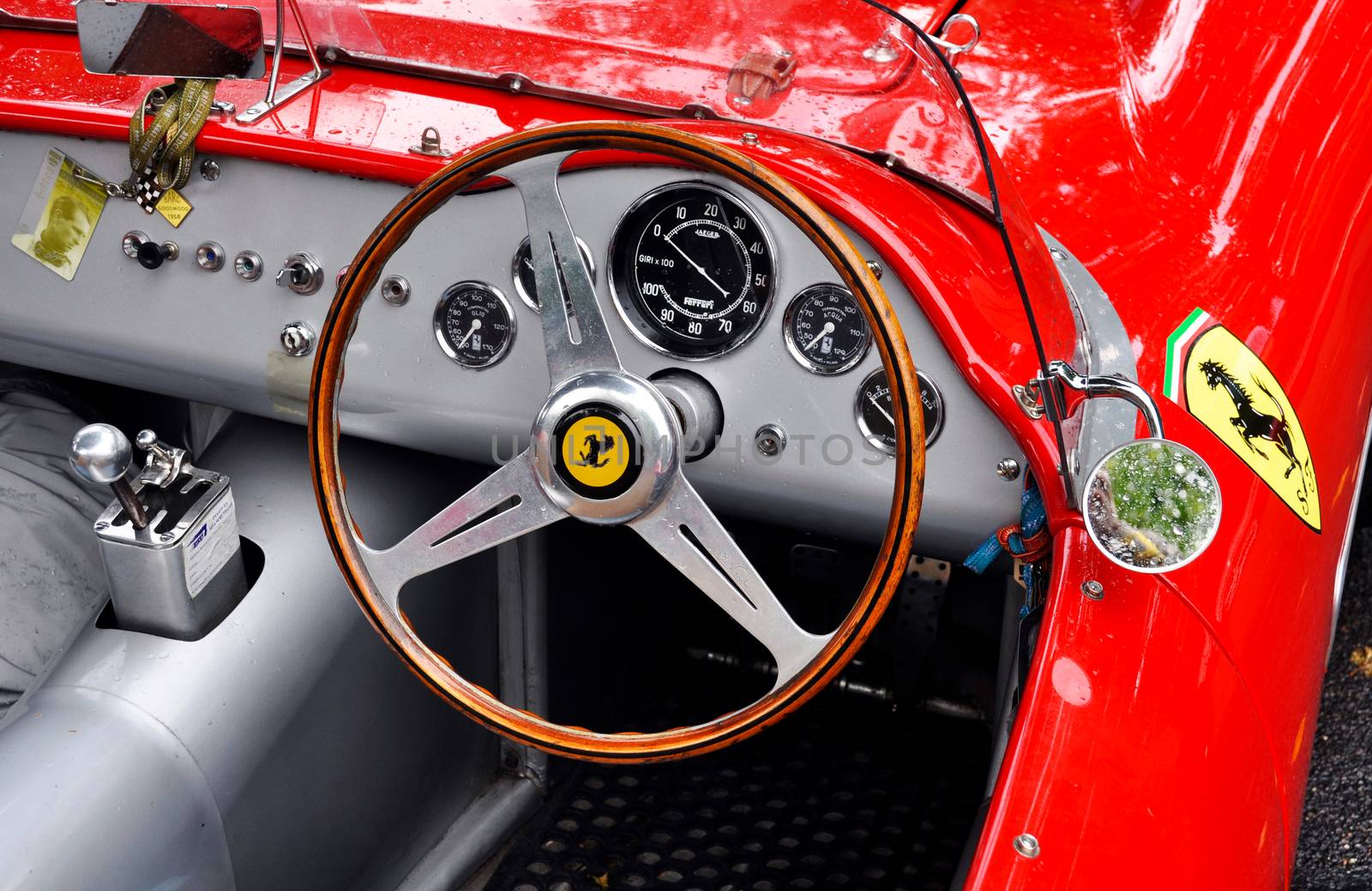 Classic Ferrari dashboard with wood steering wheel