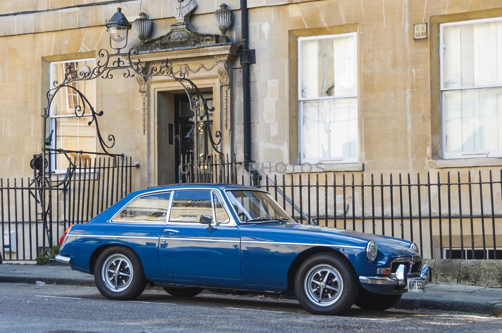 BATH, UK - CIRCA OCTOBER 2011: A blue MG MGB GT parked in the street.