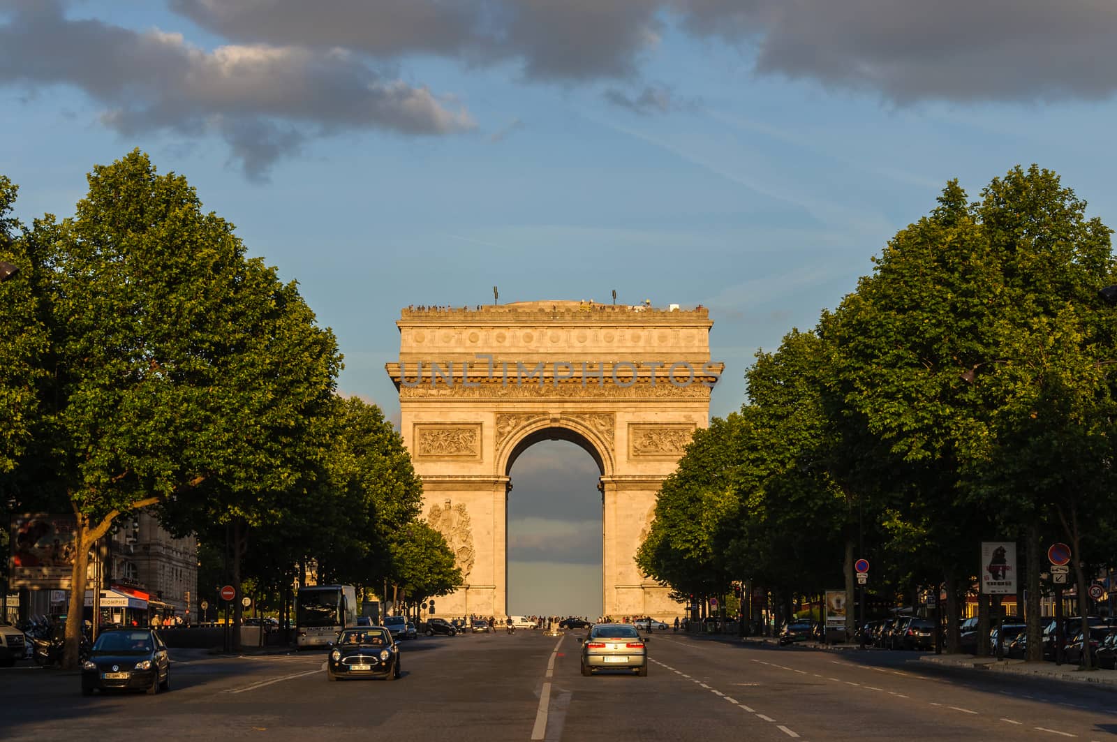 PARIS, FRANCE - CIRCA JUNE 2012: The Arc de Triomphe at sunset as seen from Avenue de la Grande Armée.