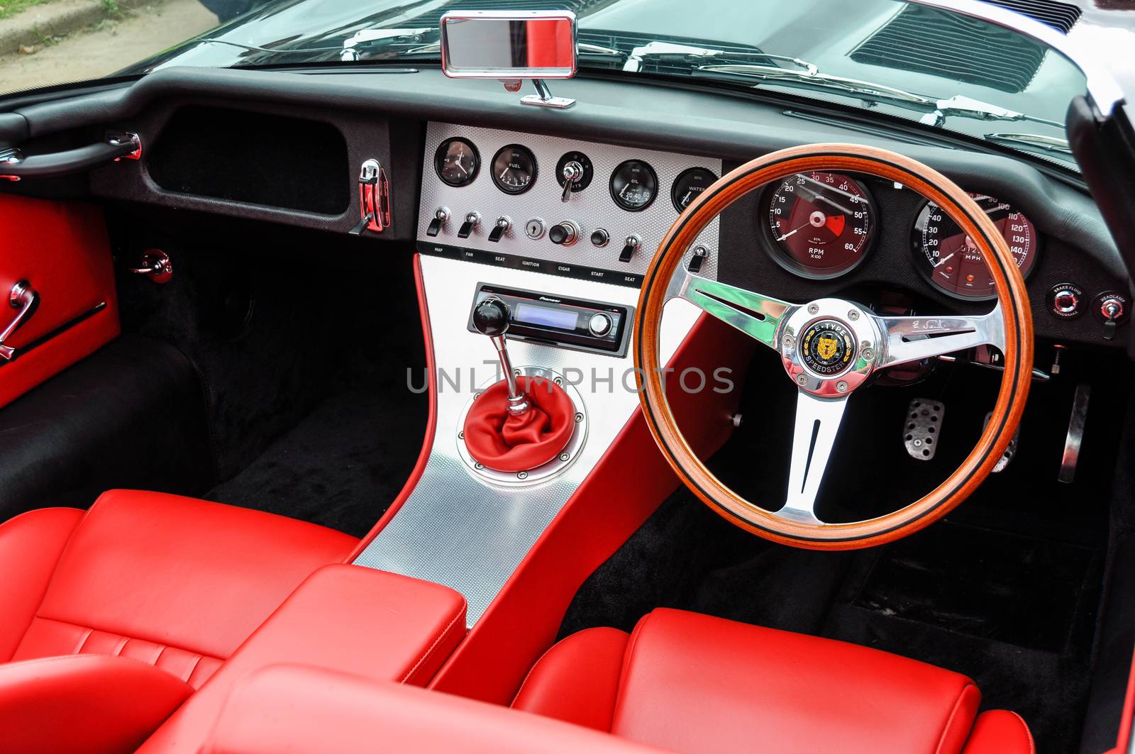 LONDON, UK - CIRCA SEPTEMBER 2011: Eagle E-Type Speedster dashboard, red leather seats. The Eagle E-Type is a restored and modified Jaguar E-Type.