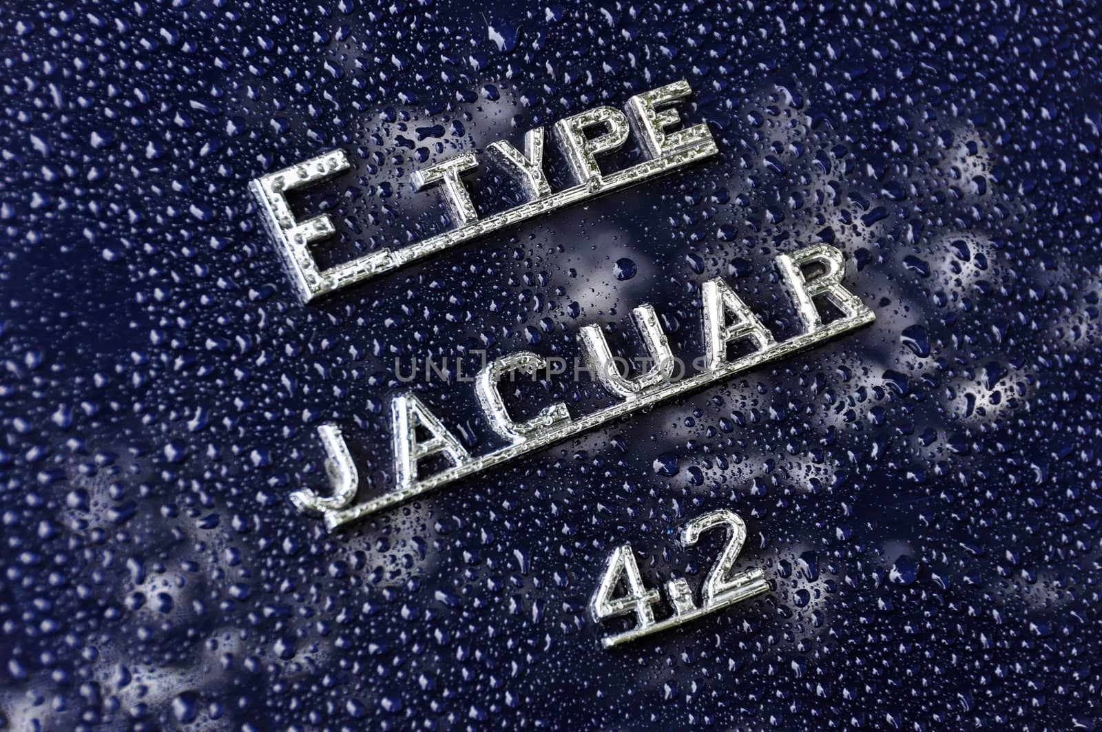Raindrops on Jaguar E-Type 4.2 sign by dutourdumonde