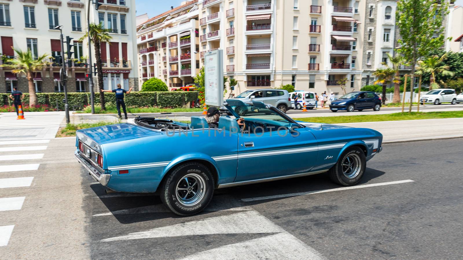 BAYONNE, FRANCE - CIRCA MAY 2020: A blue vintage Ford Mustang Convertible in the town centre.