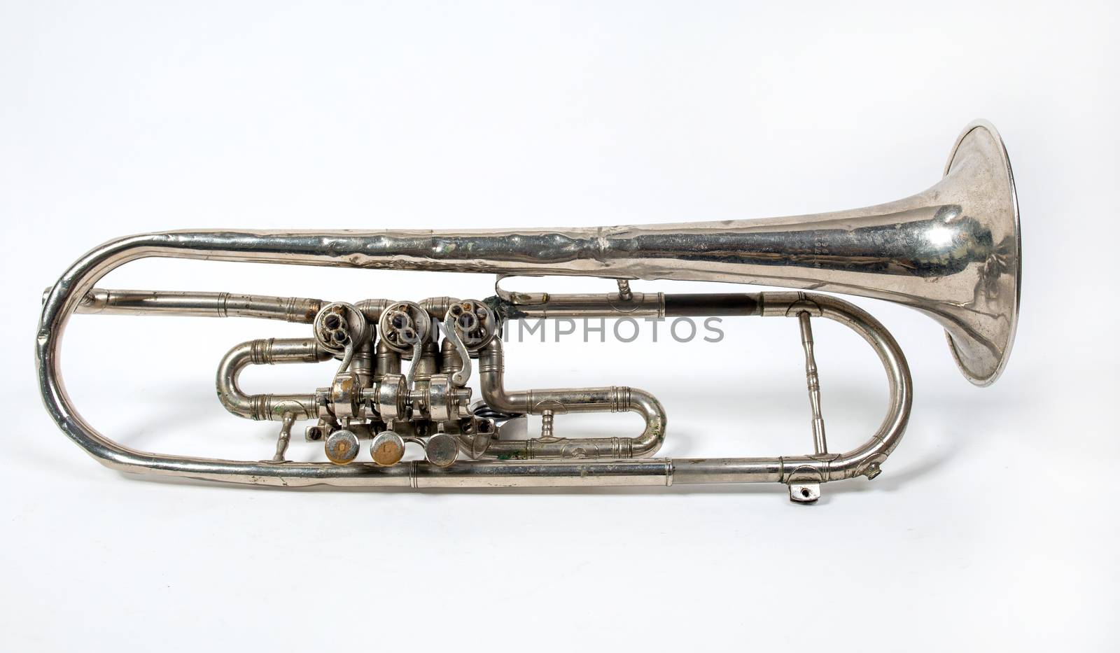 silver trumpet old isolated on a white background. Musical instrument lies