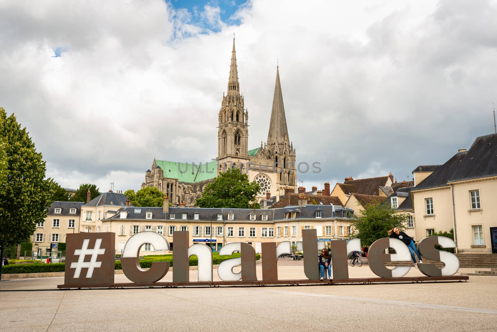 CHARTRES, FRANCE - CIRCA JUNE 2020: Hashtag Chartres sign at Chatelet Square and the cathedral in the background.