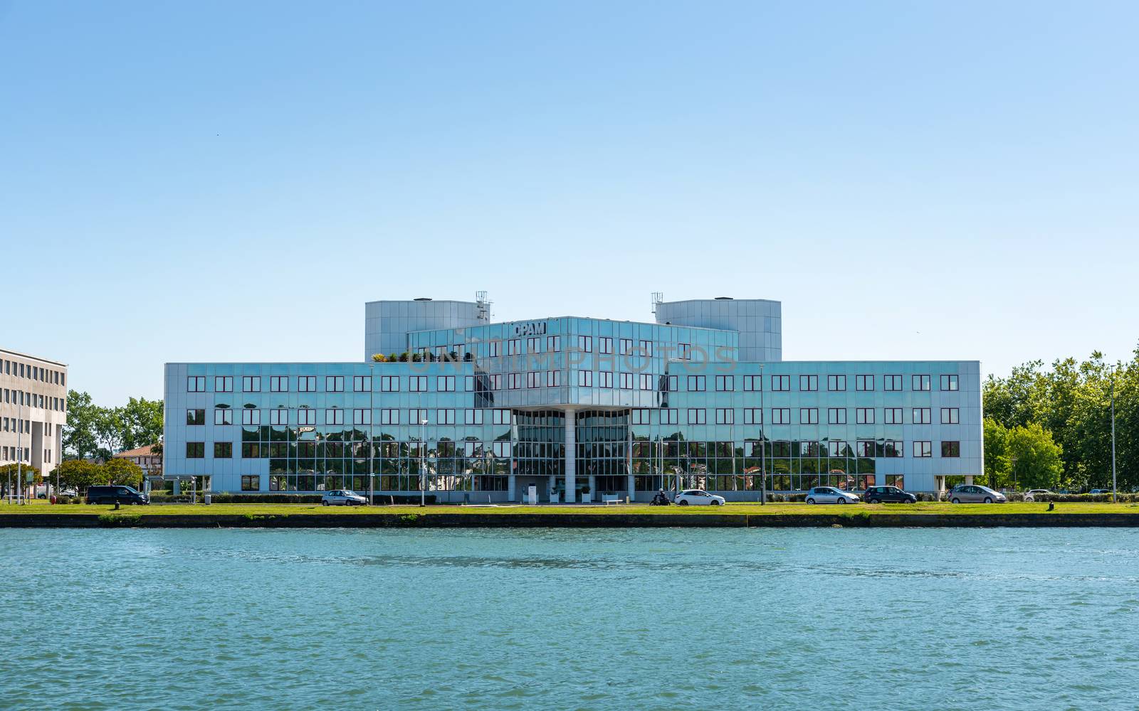 BAYONNE, FRANCE - CIRCA JUNE 2020: The CPAM (public health insurance body) office building as seen from the Adour River.