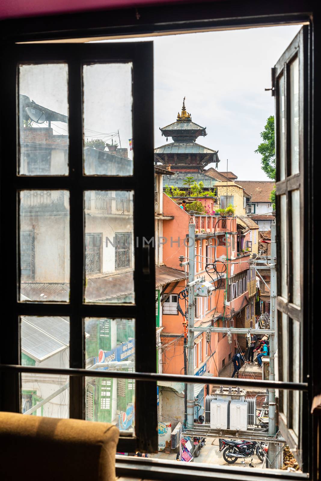 KATHMANDU, NEPAL - CIRCA APRIL 2018: Window with a view on Kathmandu Durbar Square.