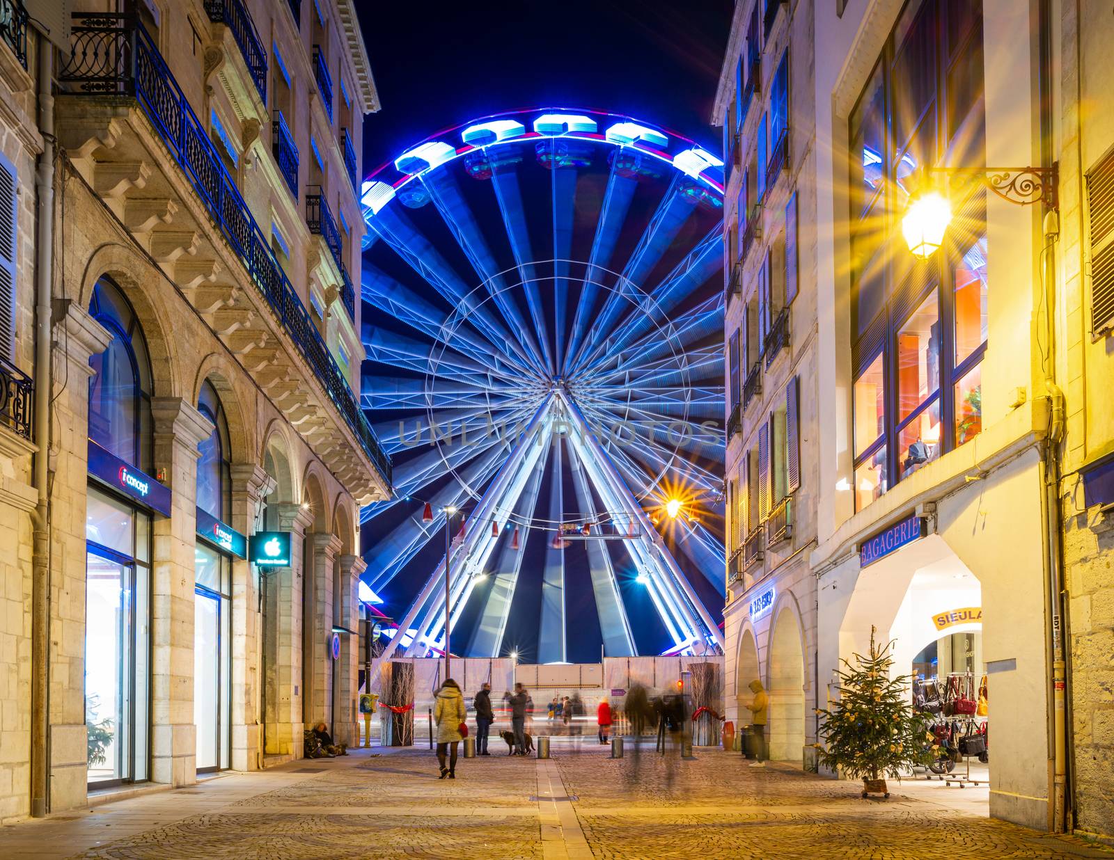 BAYONNE, FRANCE - DECEMBER 28, 2019: The ferris wheel as seen from rue Port Neuf at night.