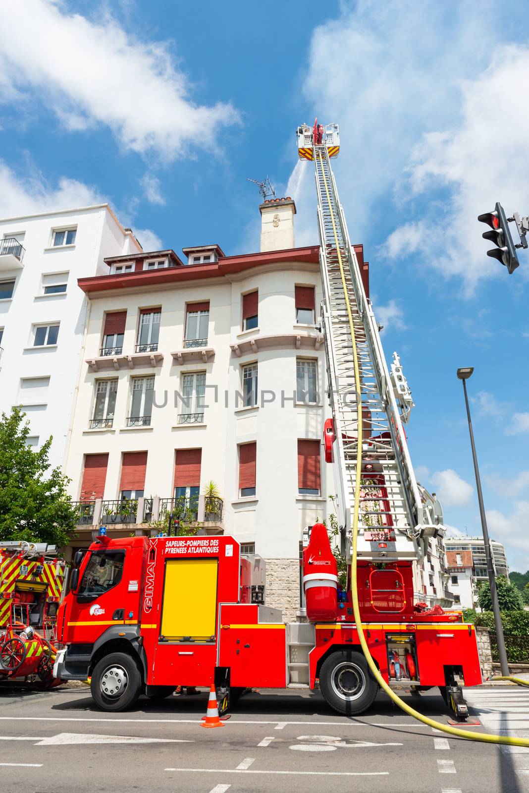 Firemen tackling apartment fire in Bayonne, France by dutourdumonde