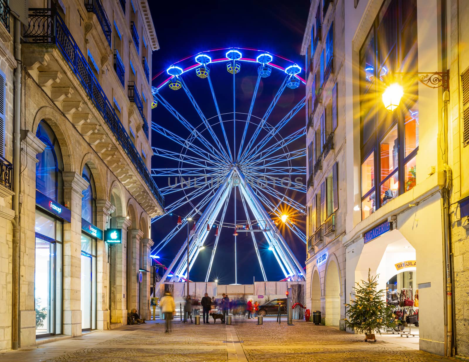 BAYONNE, FRANCE - DECEMBER 28, 2019: The ferris wheel as seen from rue Port Neuf at night.
