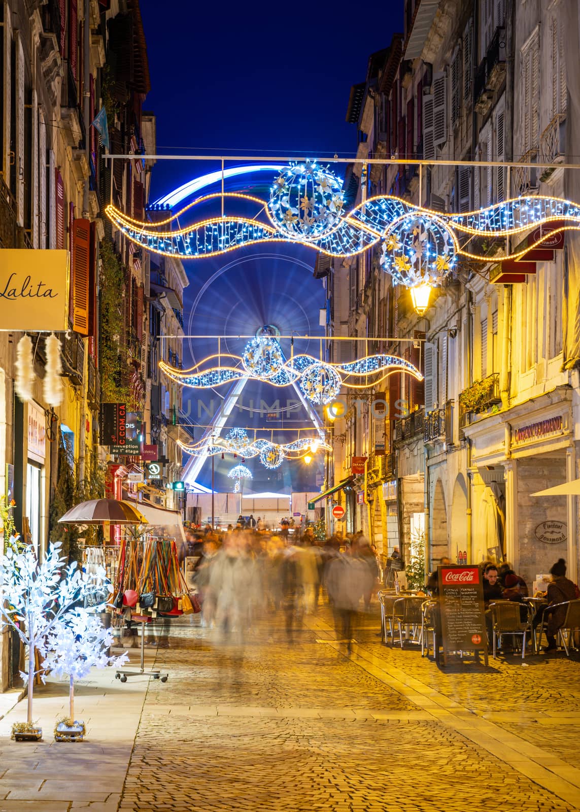 Christmas decorations in rue Port Neuf in Bayonne, France by dutourdumonde