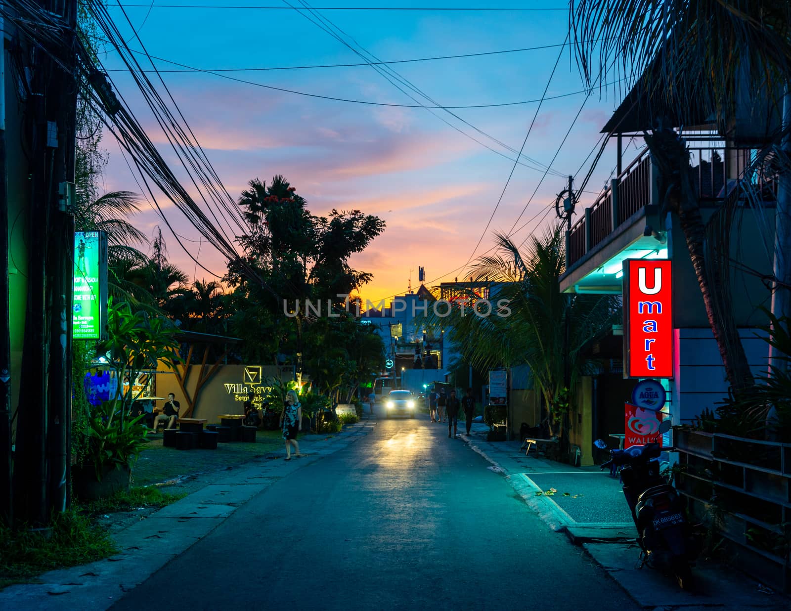 Small street in Seminyak at sunset, in Bali, Indonesia by dutourdumonde