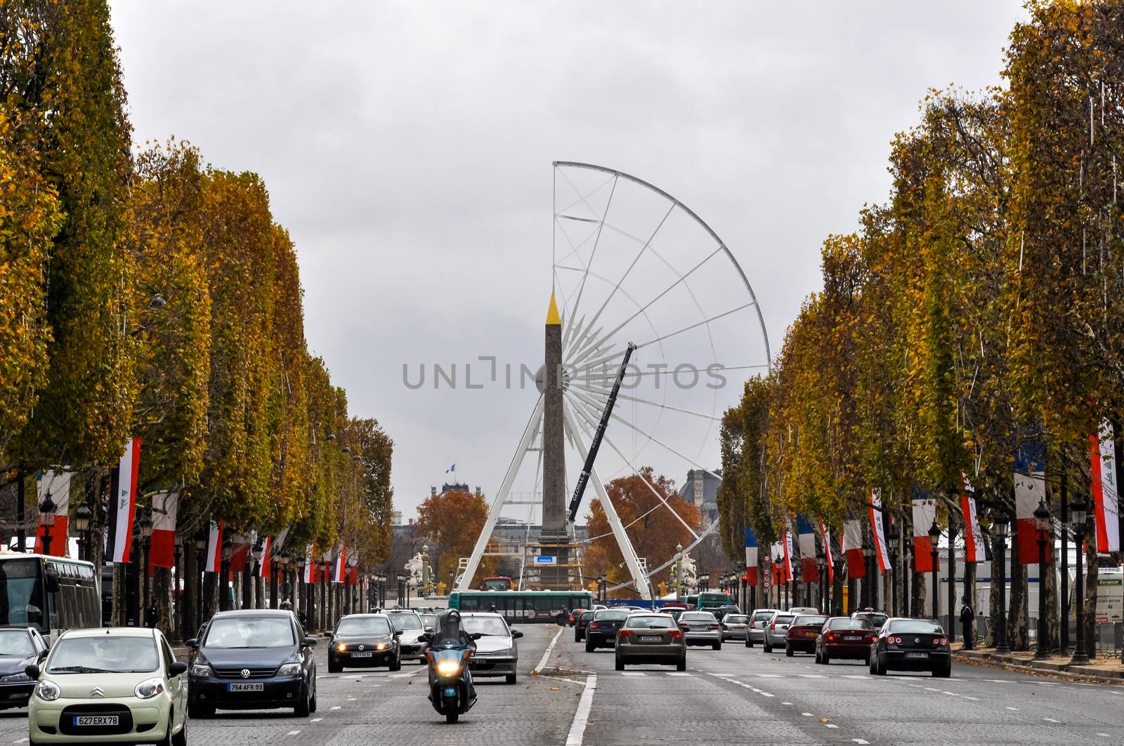 The Champs-Elysees and a ferris wheel under construction on Concorde Square in Paris, France