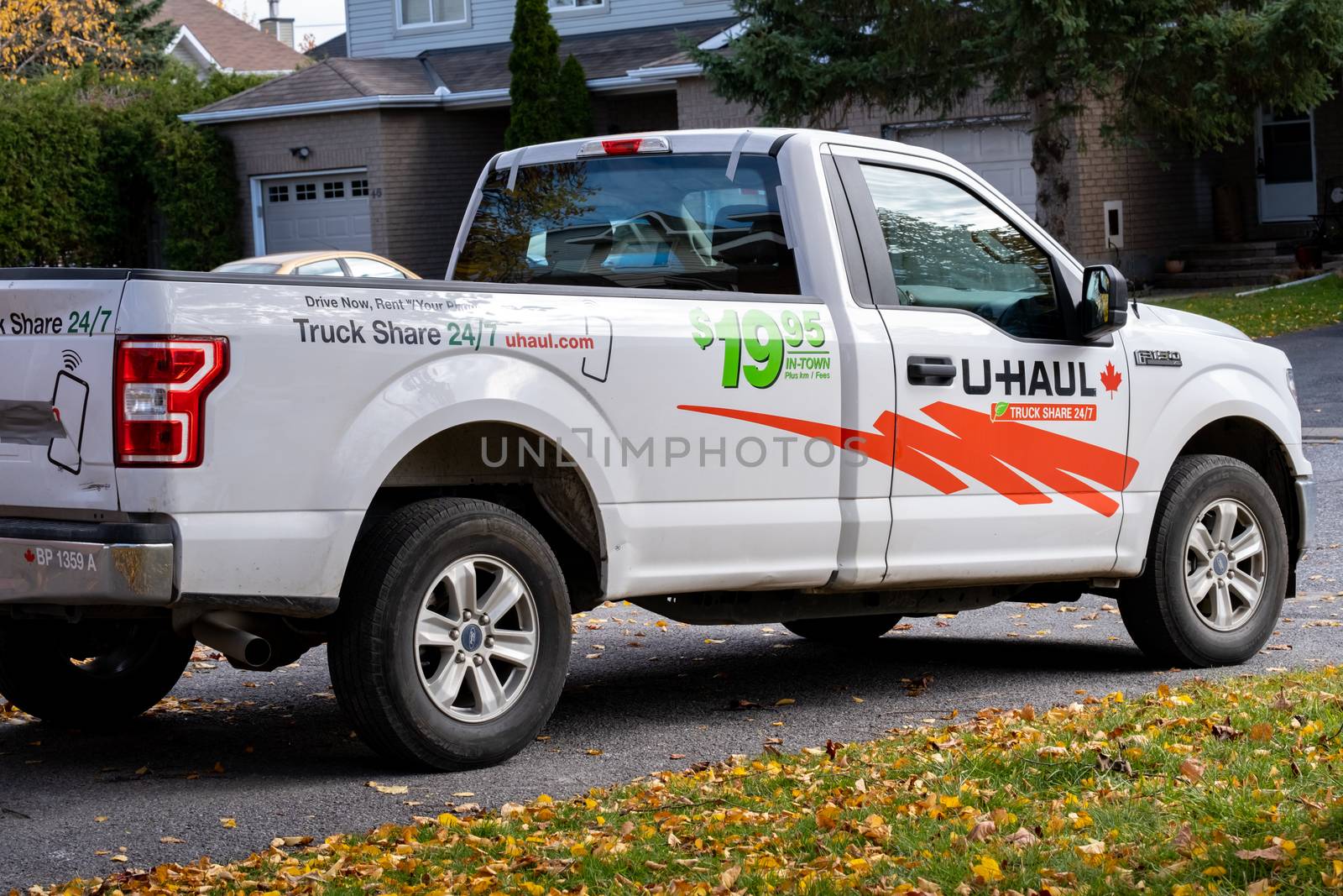 Ottawa, Ontario, Canada - October 25, 2020: A U-Haul rental pick-up truck parked in a suburban driveway.