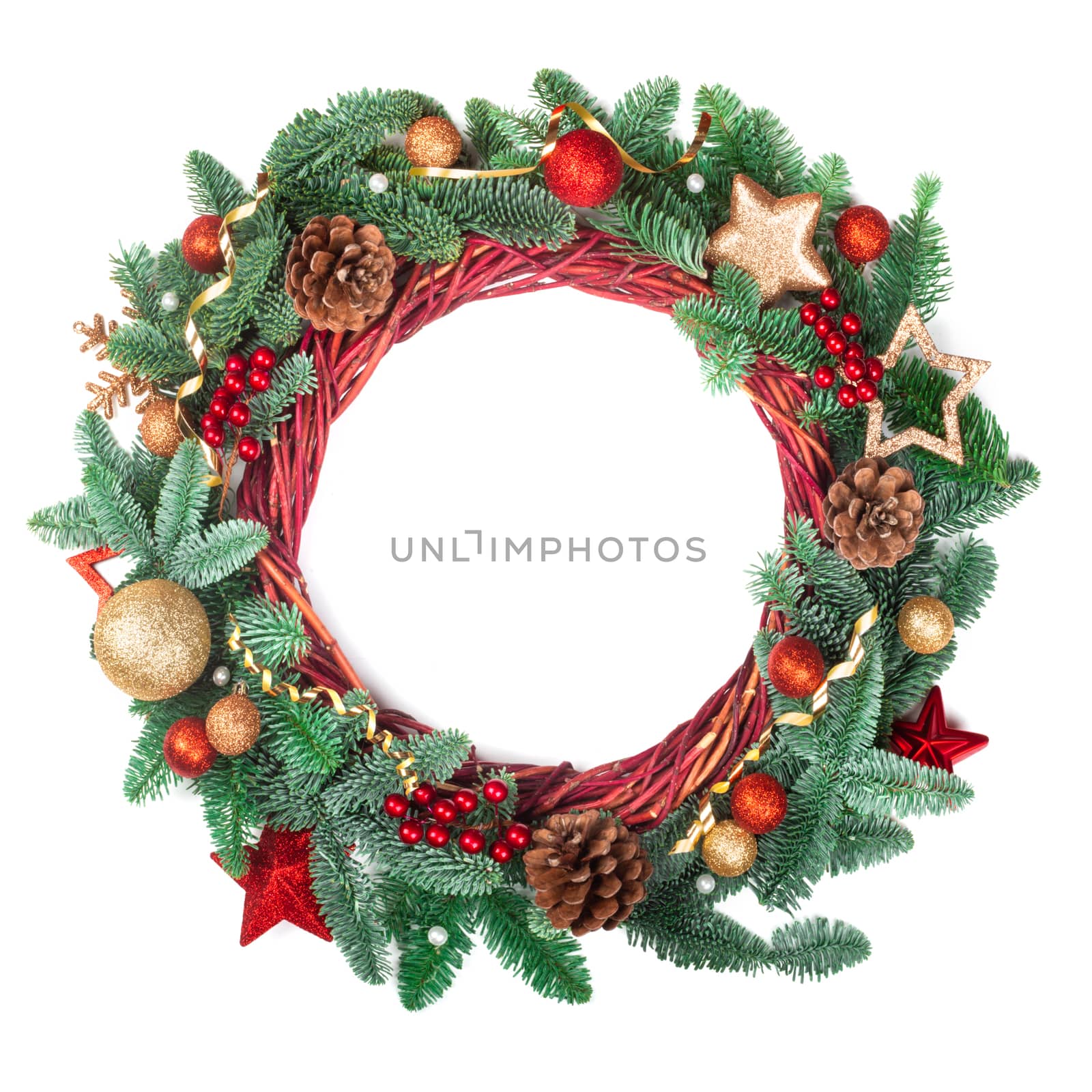Decorated Christmas wreath with pine cones and ornaments red and golden baubles stars and holly berries isolated on white background