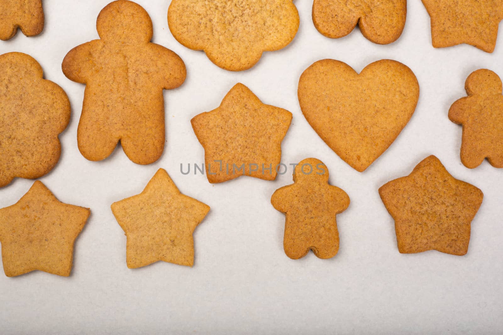 Gingerbread men stars and snowflakes not glazed cookies Christmas background