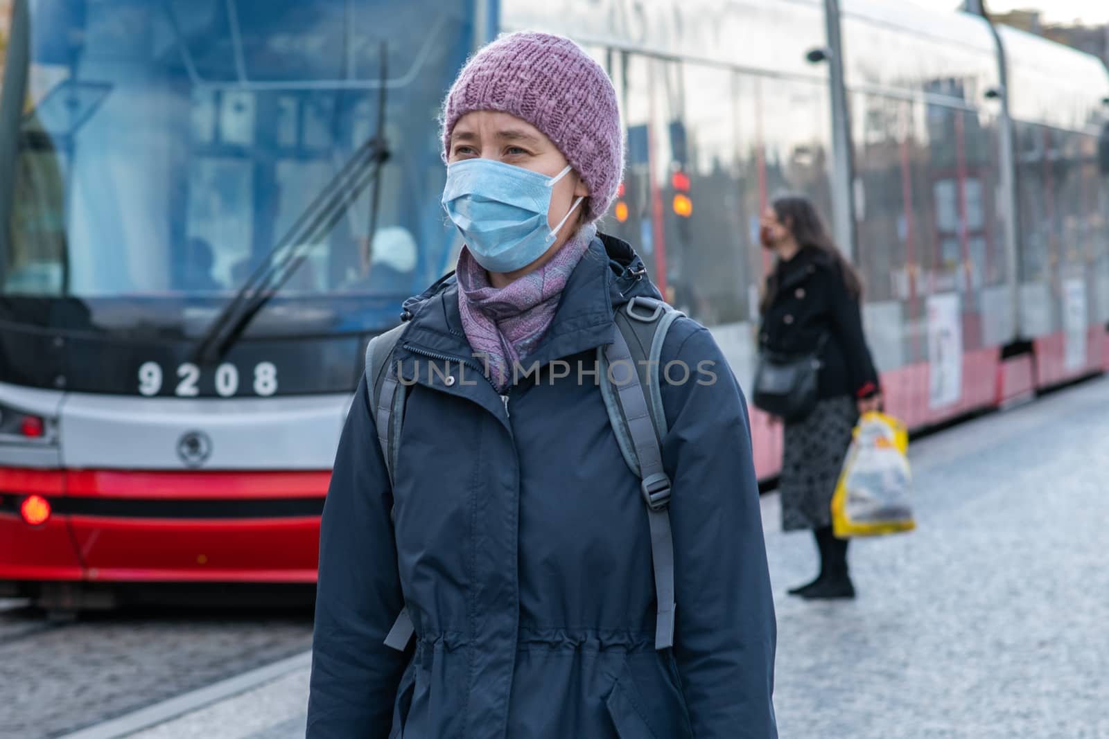 1/16/2020. Prague. Czech Republic. A woman wearing a mask at Hradcanska tram stop during quarantine. This is a lockdown period in the Czech Republic due to the increase of COVID-19 infectious in the country. Hradcanska tram stop it is in Prague 6