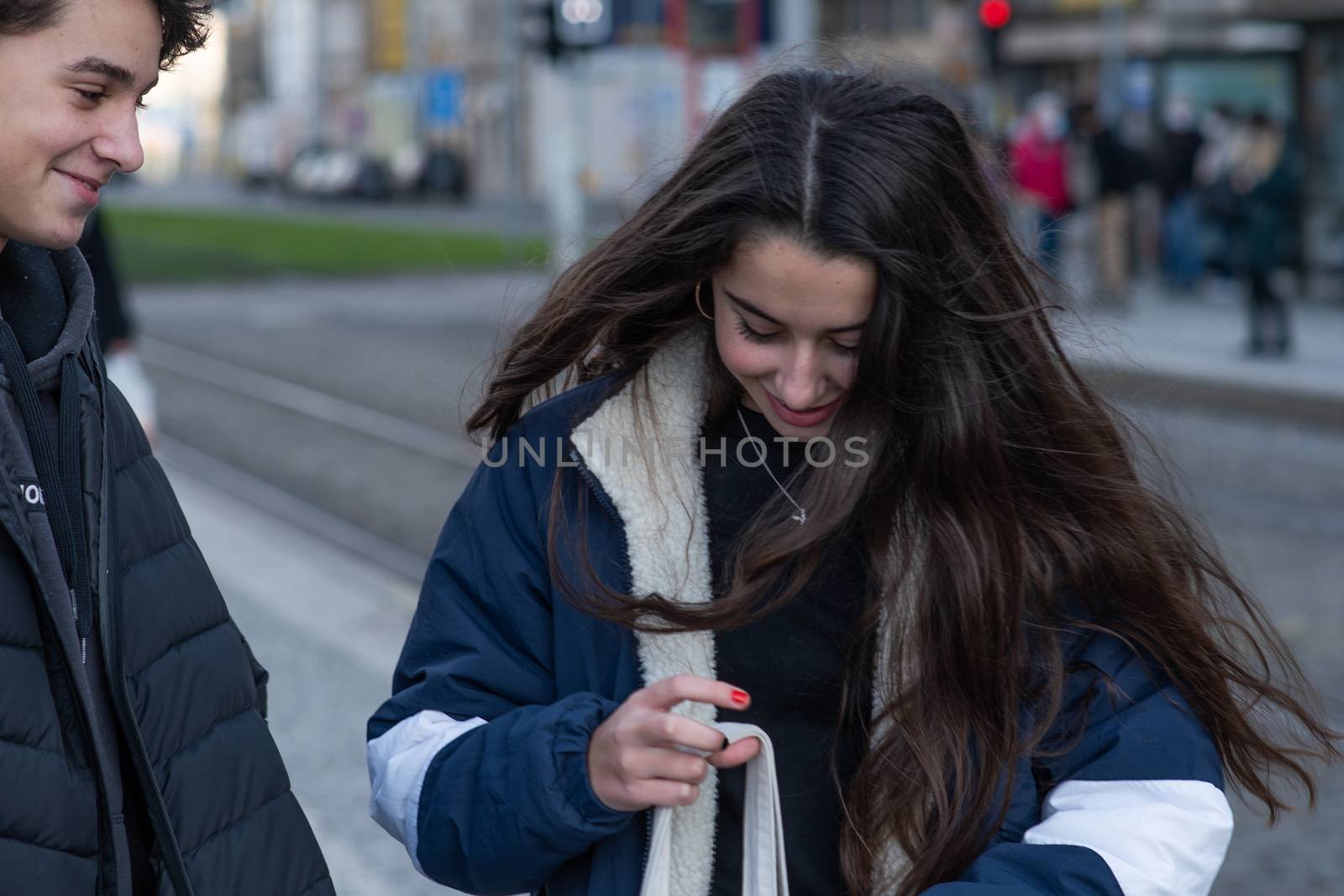 Czech Republic. A young couple are waiting for a tram at Hradcanska tram stop during quarantine. This is a lockdown period in the Czech Republic due to the increase of COVID-19 infectious in the country. Hradcanska tram stop it is in Prague 6