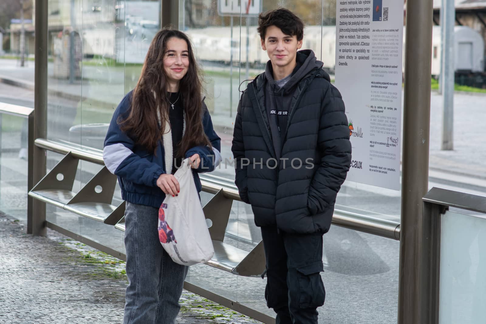11/16/20. Czech Republic. A young couple are waiting for a tram at Hradcanska tram stop during quarantine. by gonzalobell