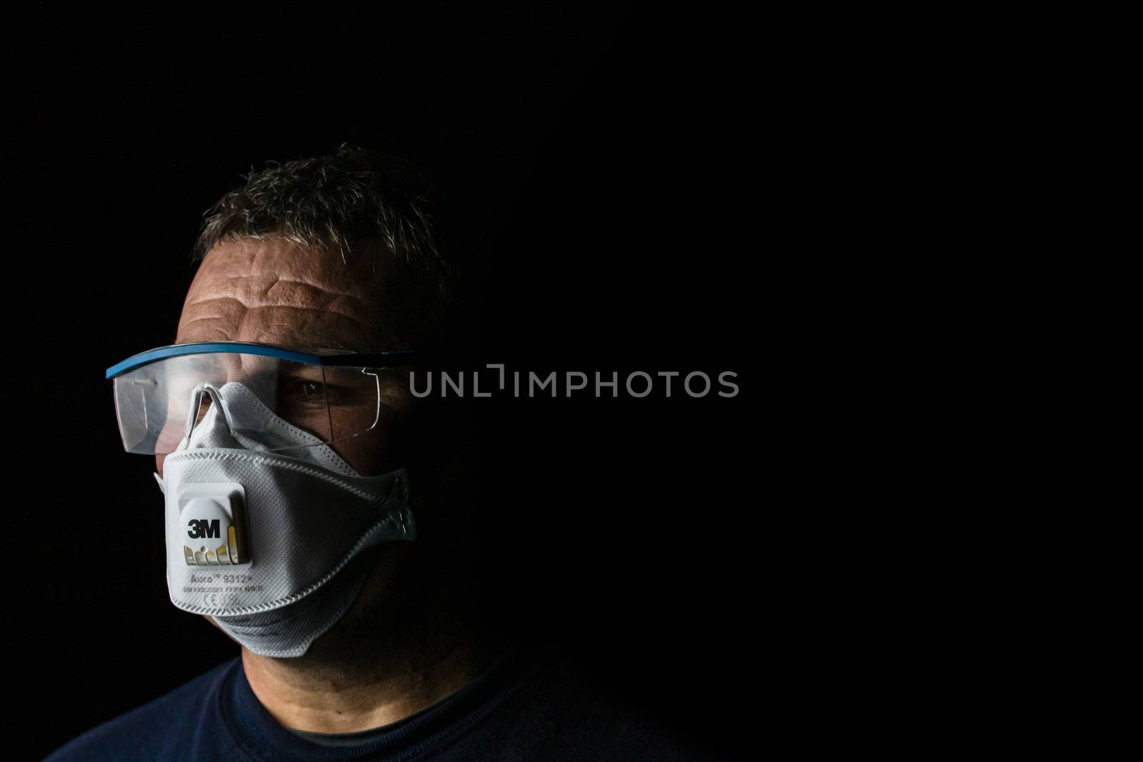 Man with protective 3M medical mask. 3M Aura 9312. The face mask used in the COVID-19 global pandemic as a protection against coronavirus in Bucharest, Romania, 2020