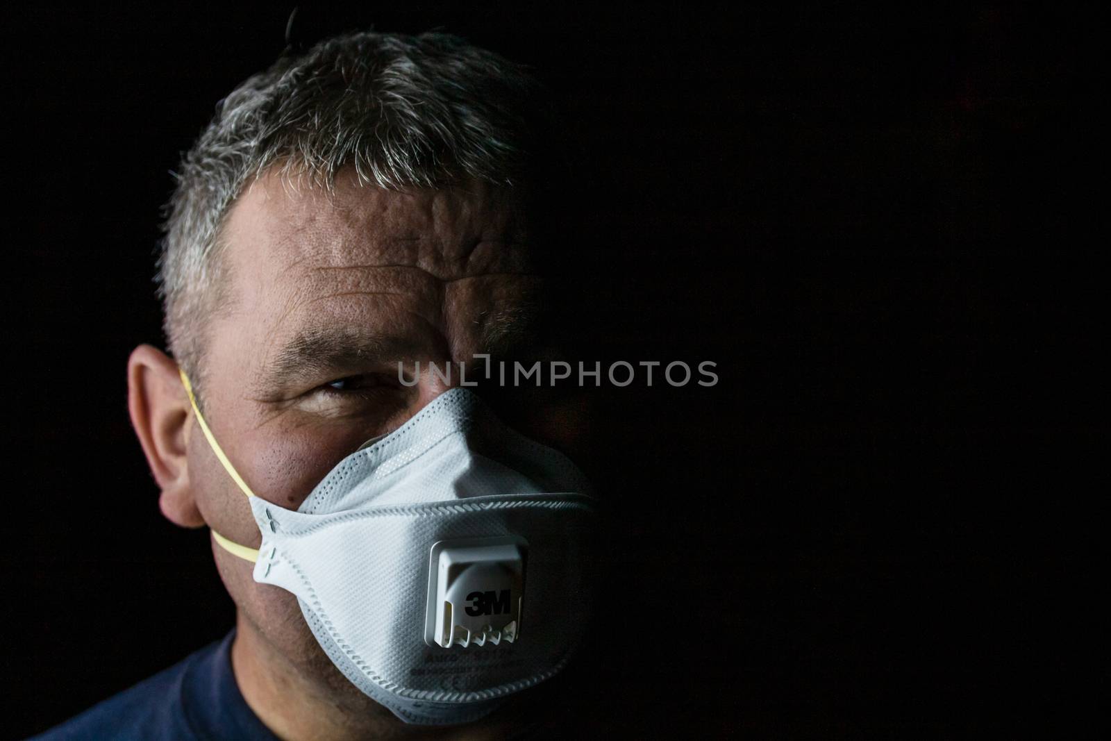 Man with protective 3M medical mask. 3M Aura 9312. The face mask used in the COVID-19 global pandemic as a protection against coronavirus in Bucharest, Romania, 2020