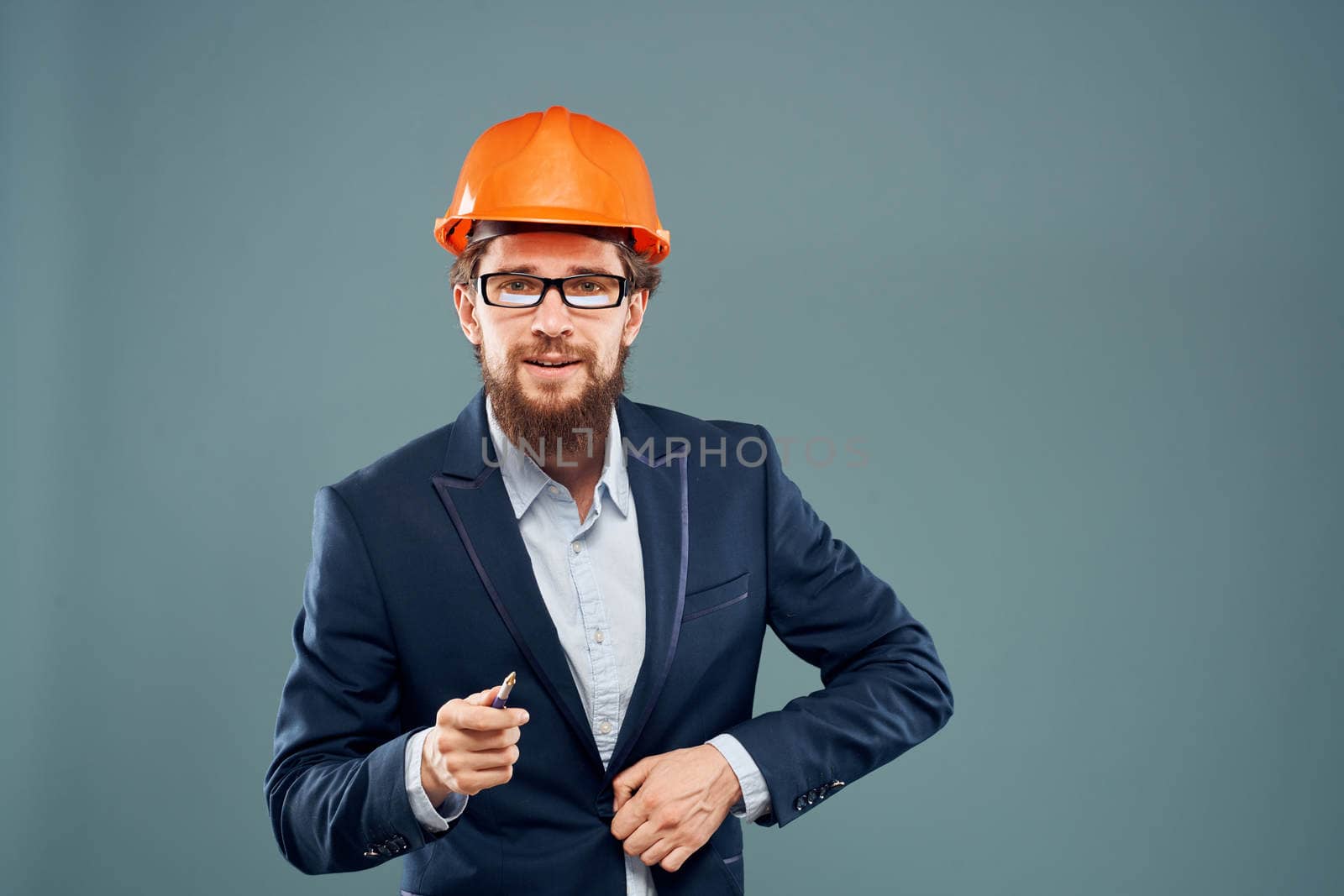 Man in orange paint construction engineer lifestyle cropped view. High quality photo