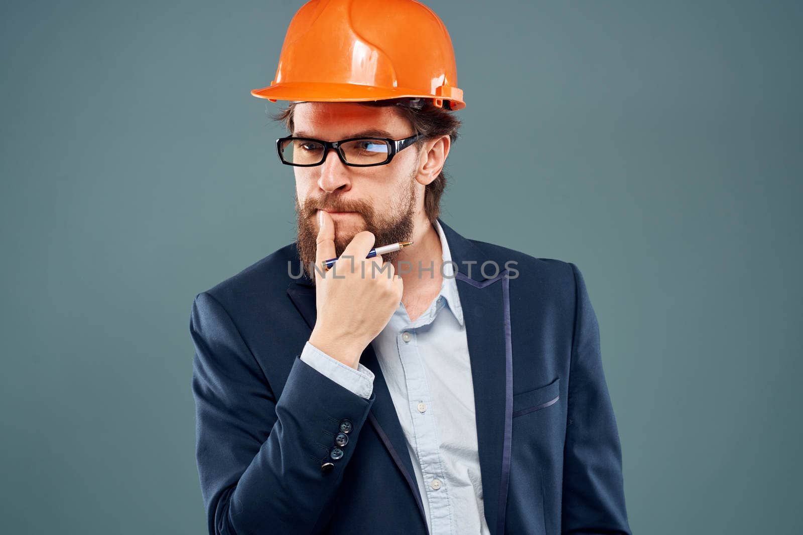 man in suit orange helmet professional safety industry lifestyle. High quality photo