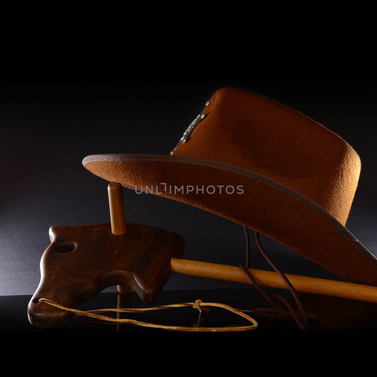 A wooden horse and hat for a playful cowboy theme.