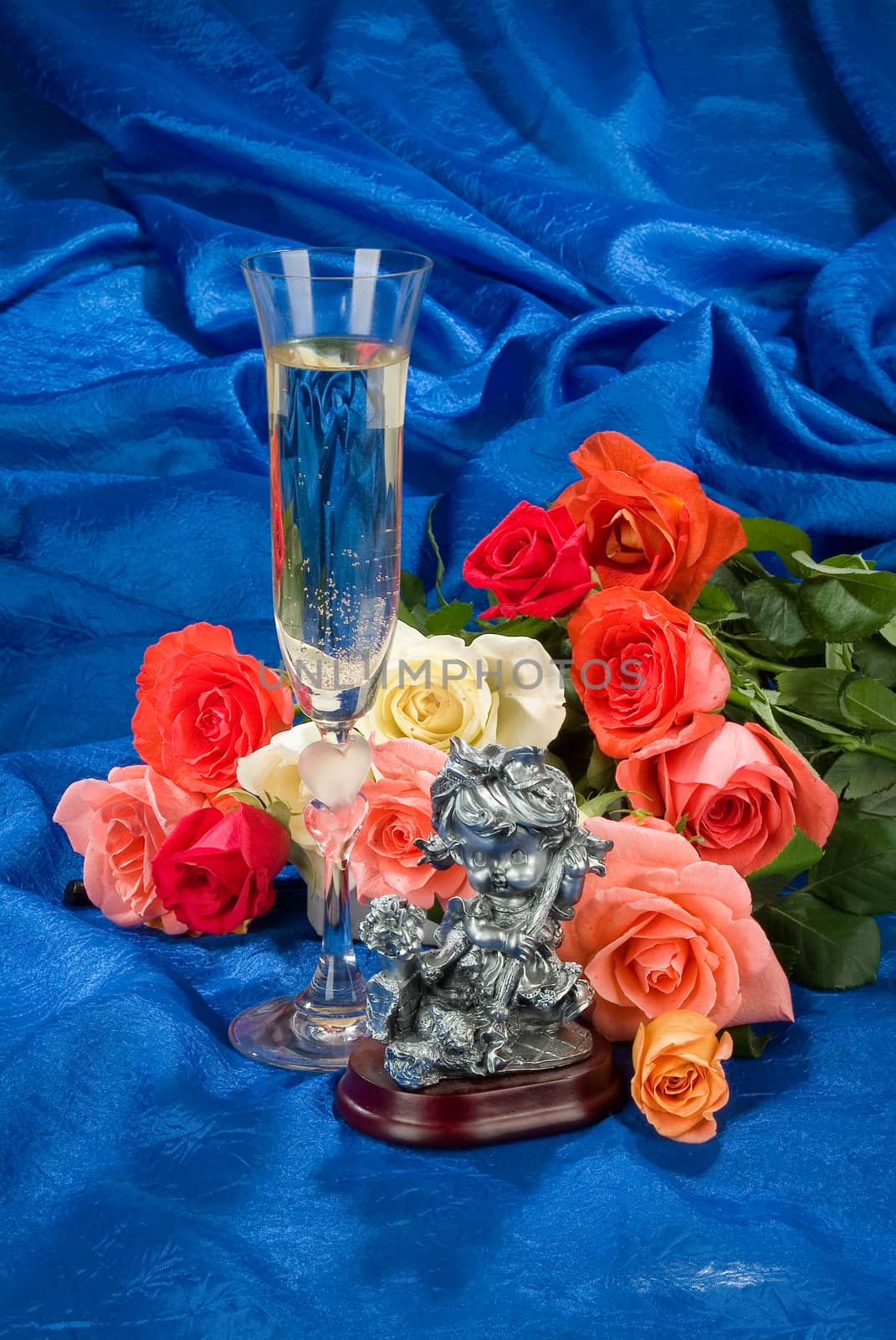 Still life with bouquet of flowers and accessories on a studio background