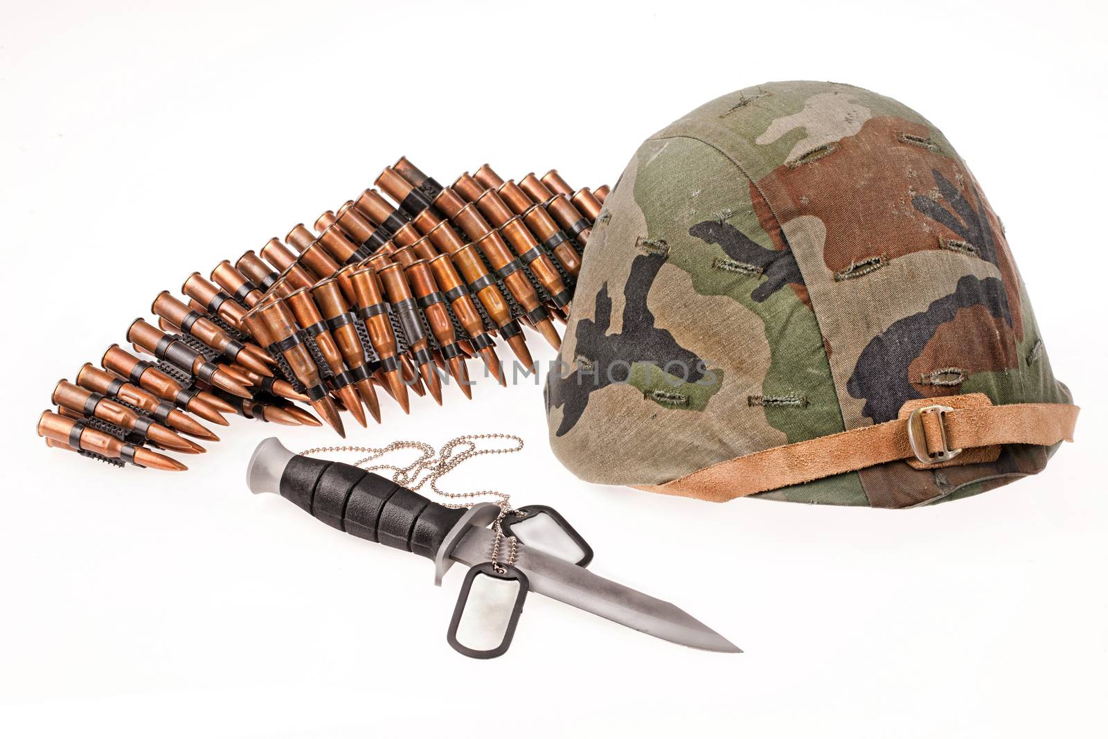 Army helmet, cartridges, knife and badge on isolated background