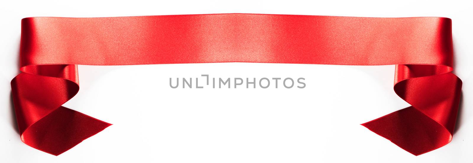 Red satin ribbon banner isolated on white background