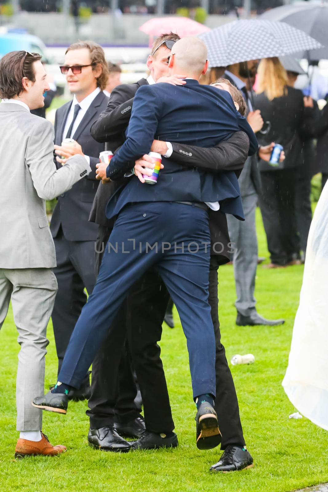 MELBOURNE, AUSTRALIA - NOVEMBER 2: Drunk punters at the end of Derby Day at the 2019 Melbourne Cup Carnival at Flemington Racecourse in Melbourne Australia