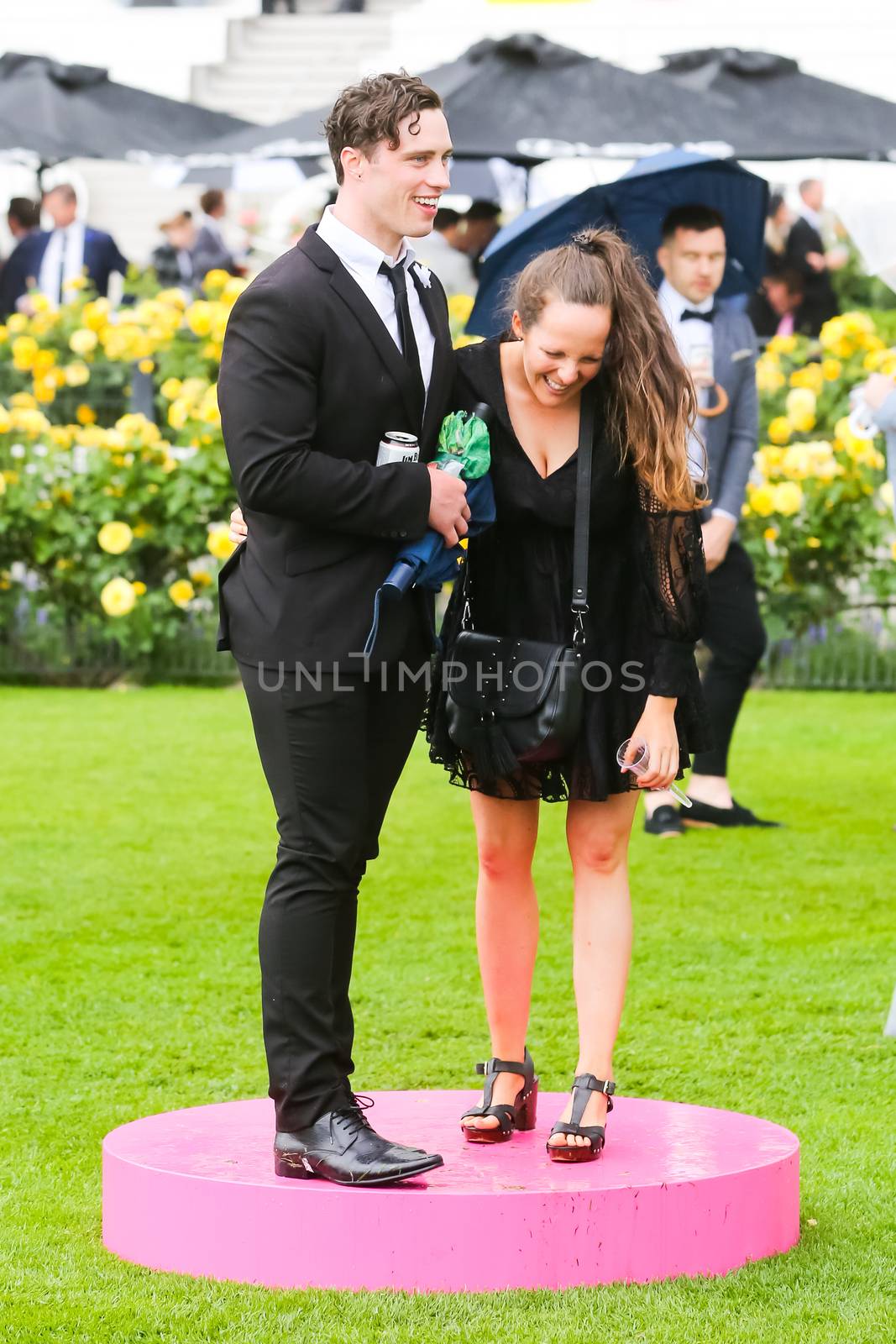 MELBOURNE, AUSTRALIA - NOVEMBER 2: Drunk punters at the end of Derby Day at the 2019 Melbourne Cup Carnival at Flemington Racecourse in Melbourne Australia