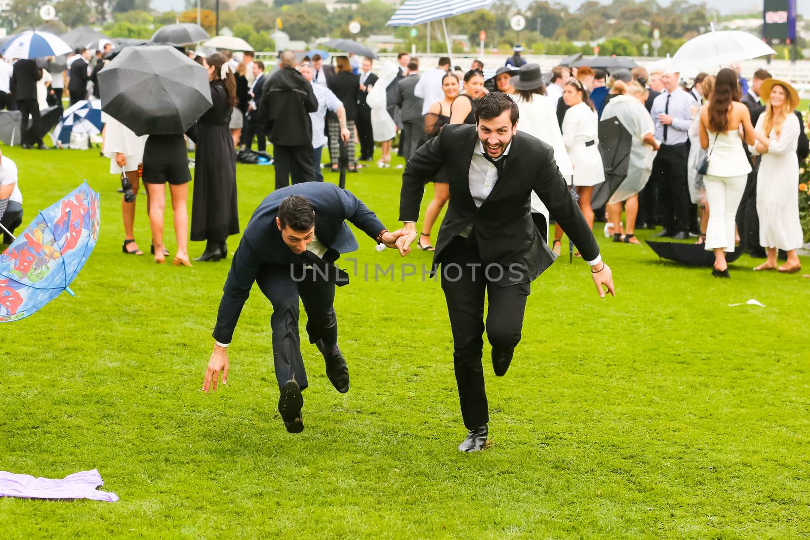 MELBOURNE, AUSTRALIA - NOVEMBER 2: Drunk punters at the end of Derby Day at the 2019 Melbourne Cup Carnival at Flemington Racecourse in Melbourne Australia
