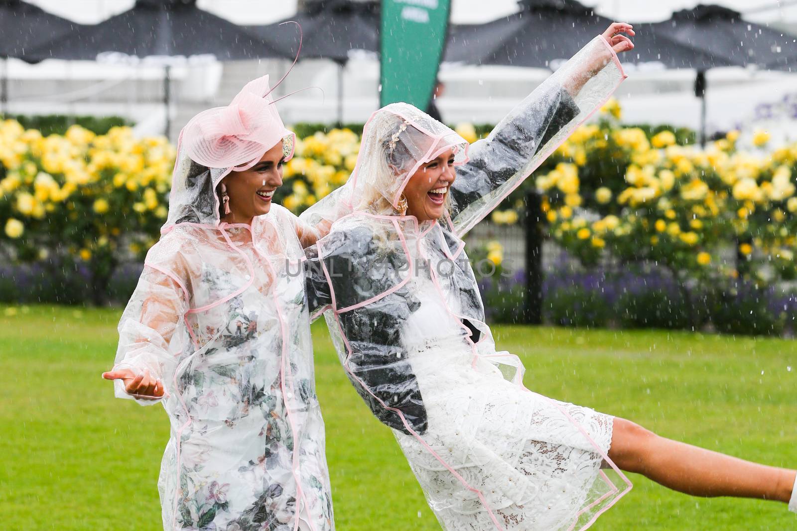 MELBOURNE, AUSTRALIA - NOVEMBER 6: Guests braving the rain on Lexus Melbourne Cup Day at the 2018 Melbourne Cup Carnival