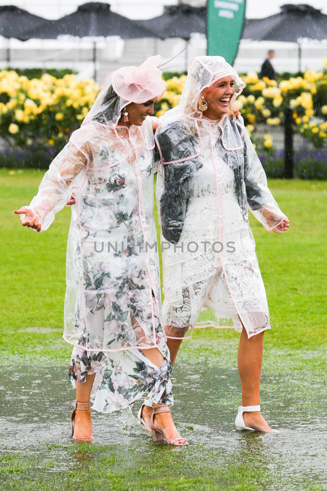 MELBOURNE, AUSTRALIA - NOVEMBER 6: Guests braving the rain on Lexus Melbourne Cup Day at the 2018 Melbourne Cup Carnival