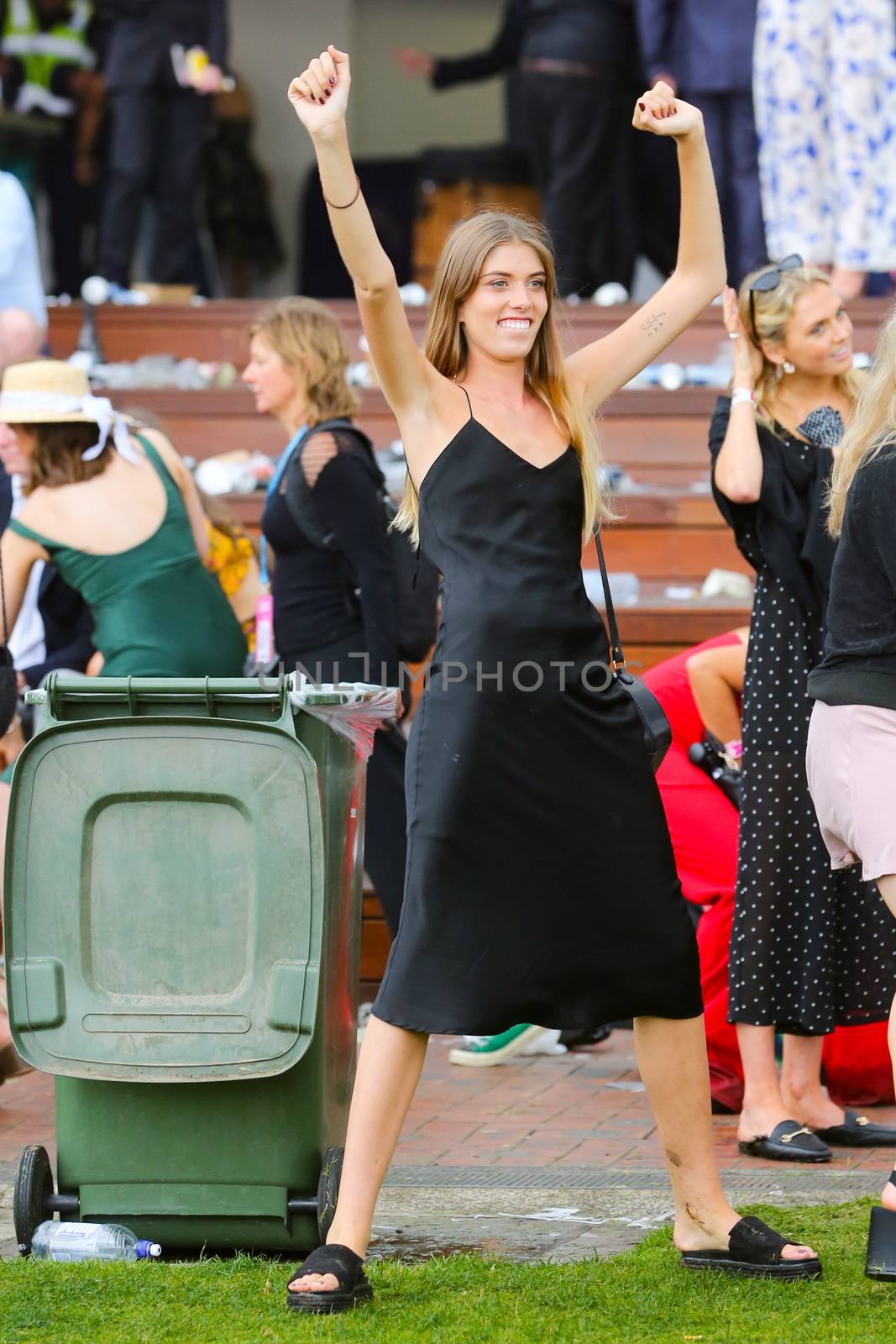 MELBOURNE, AUSTRALIA - NOVEMBER 6: Drunk punters at the end of the day during the Lexus Melbourne Cup Day at the 2018 Melbourne Cup Carnival