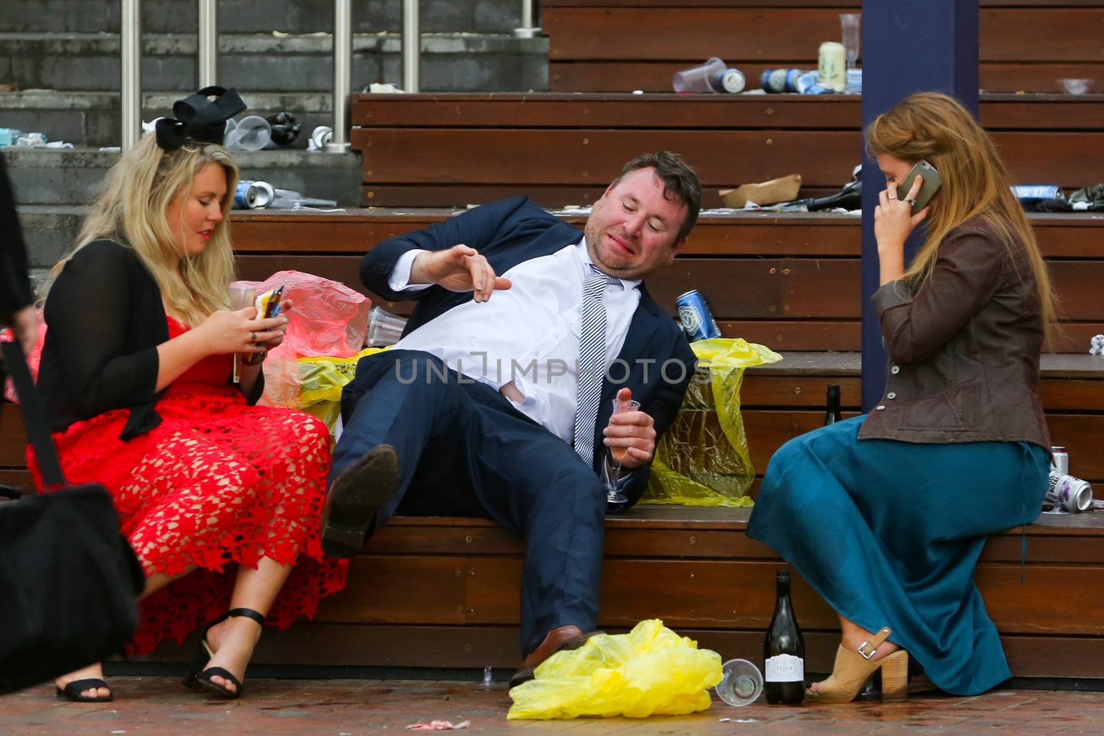 MELBOURNE, AUSTRALIA - NOVEMBER 6: Drunk punters at the end of the day during the Lexus Melbourne Cup Day at the 2018 Melbourne Cup Carnival