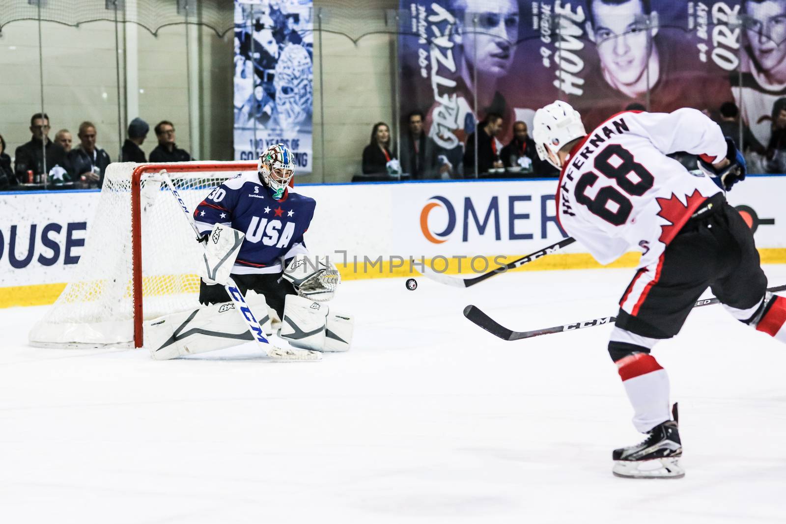 MELBOURNE, AUSTRALIA - JUNE 21: Max Strang of USA defends against Shane Heffernan of Canada in the 2019 Ice Hockey Classic in Melbourne, Australia