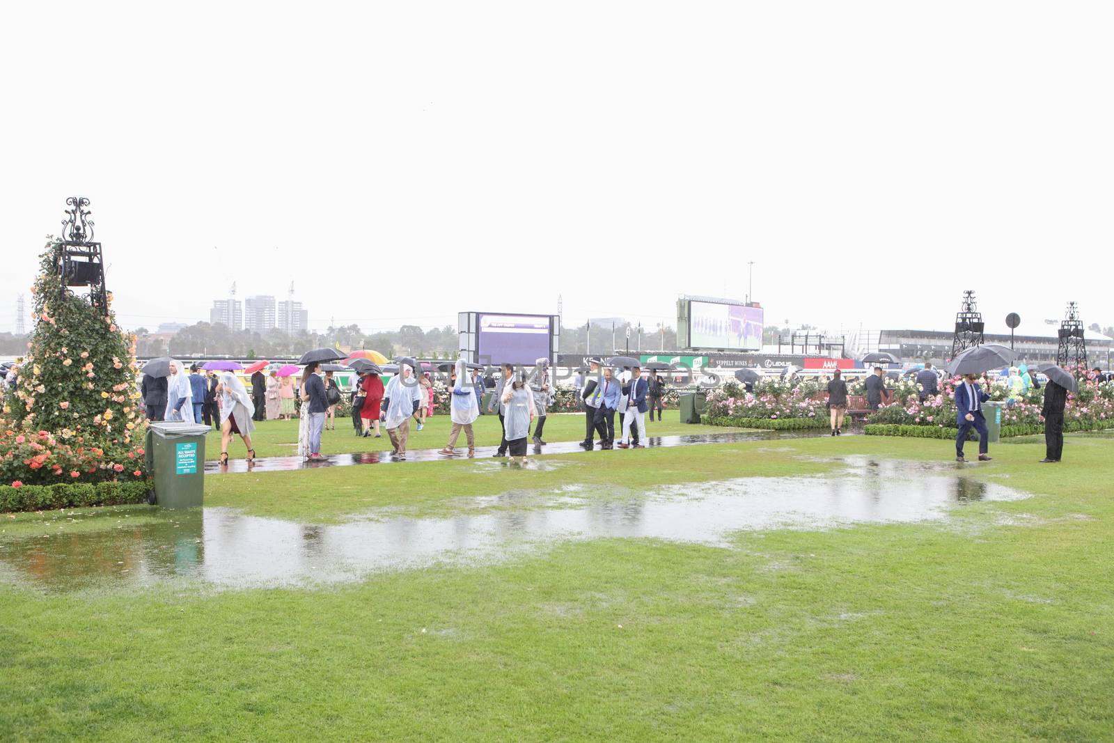 MELBOURNE, AUSTRALIA - NOVEMBER 6: Guests braving the rain on Lexus Melbourne Cup Day at the 2018 Melbourne Cup Carnival