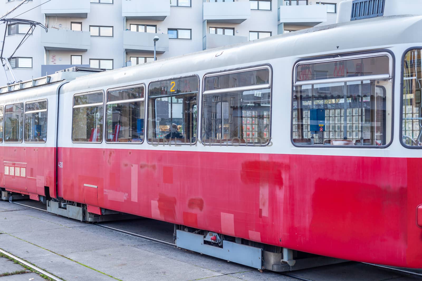 tram at the stop in the city center, public transport.