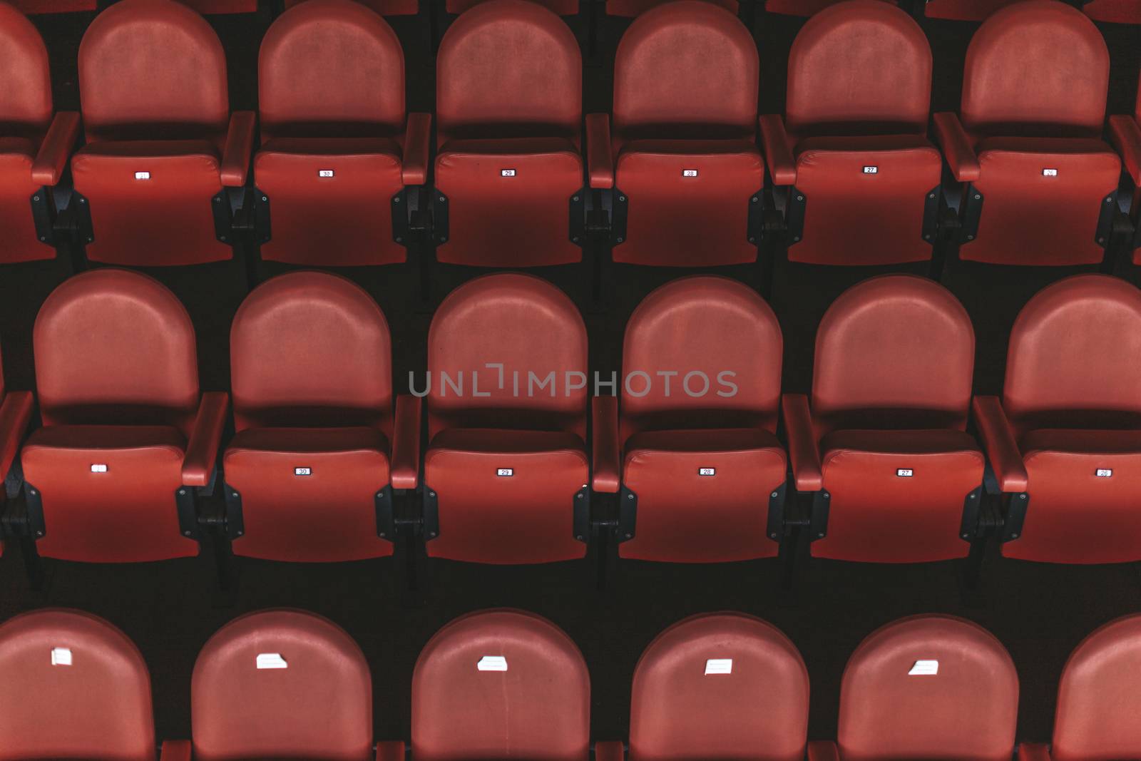 empty red chairs in the outdoor arena.