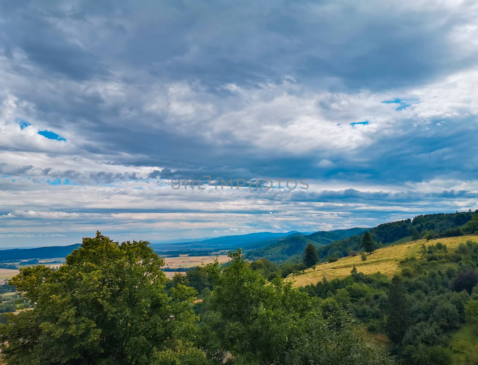 Look to small village in mountains and fields