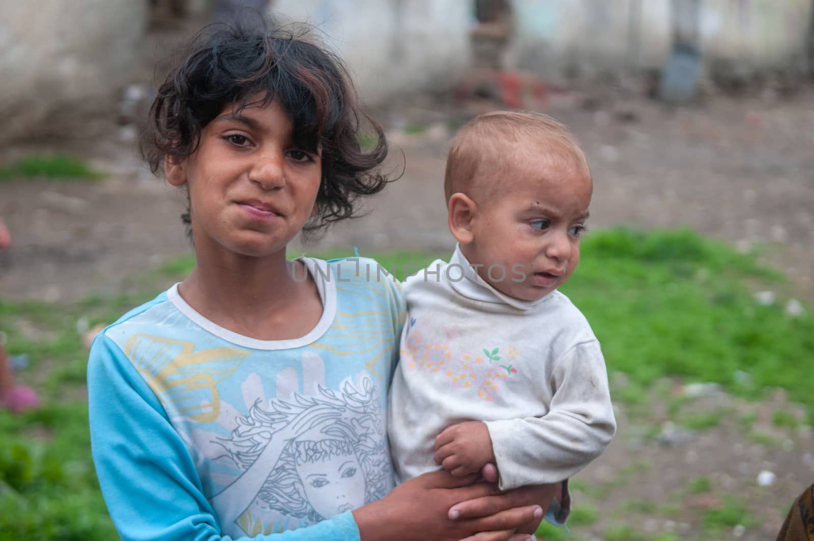 5/16/2018. Lomnicka, Slovakia. Roma community in the heart of Slovakia, living in horrible conditions. Portrait of girl and sister.. by gonzalobell