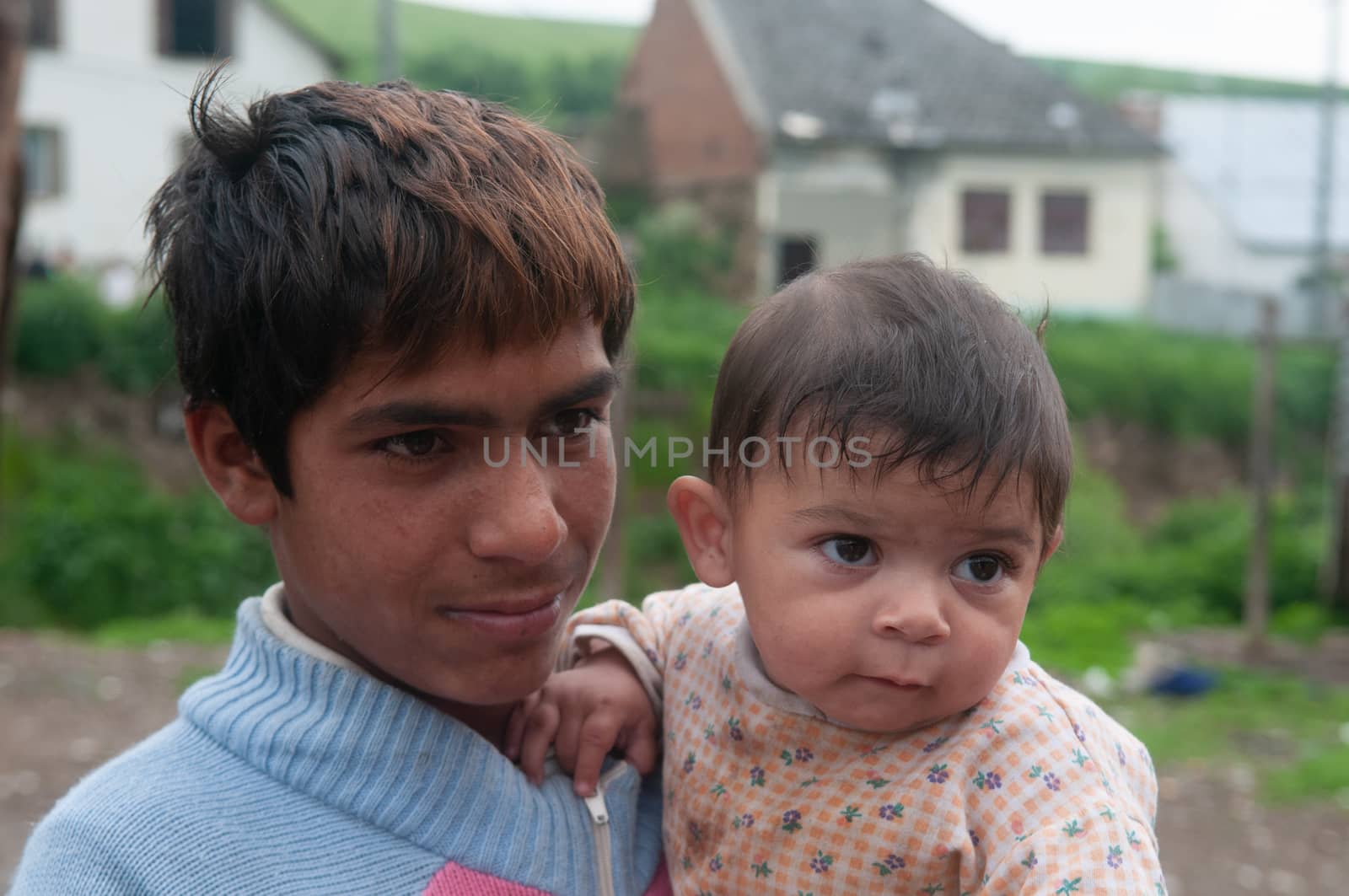 5/16/2018. Lomnicka, Slovakia. Roma community in the heart of Slovakia, living in horrible conditions. Portrait of father and baby. by gonzalobell