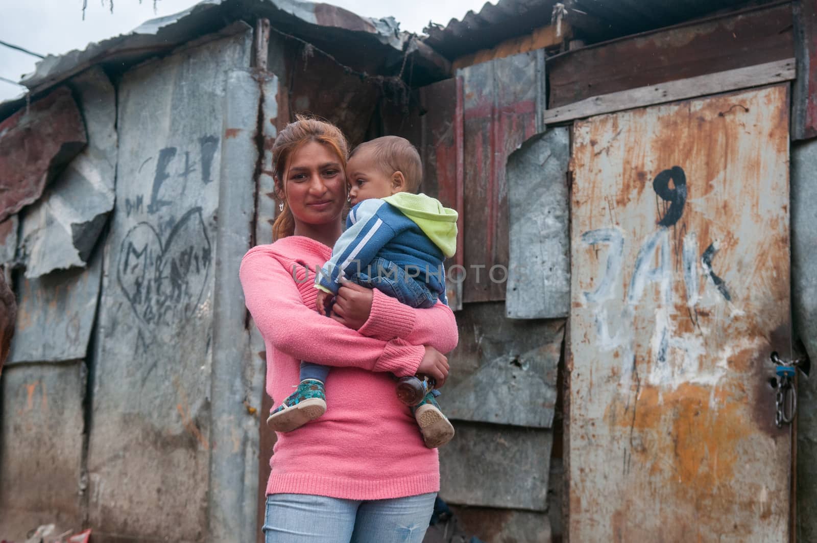 5/16/2018. Lomnicka, Slovakia. Roma community in the heart of Slovakia, living in horrible conditions. Portrait of mother and baby. by gonzalobell