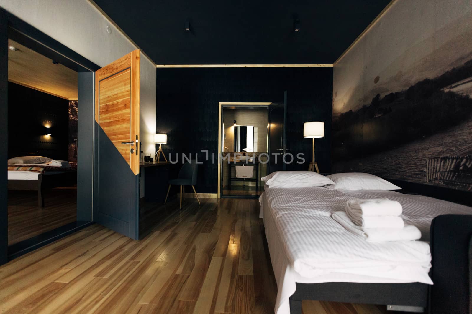 Hotel room. Wood finish. Beautiful interior. White bed by TrEKone