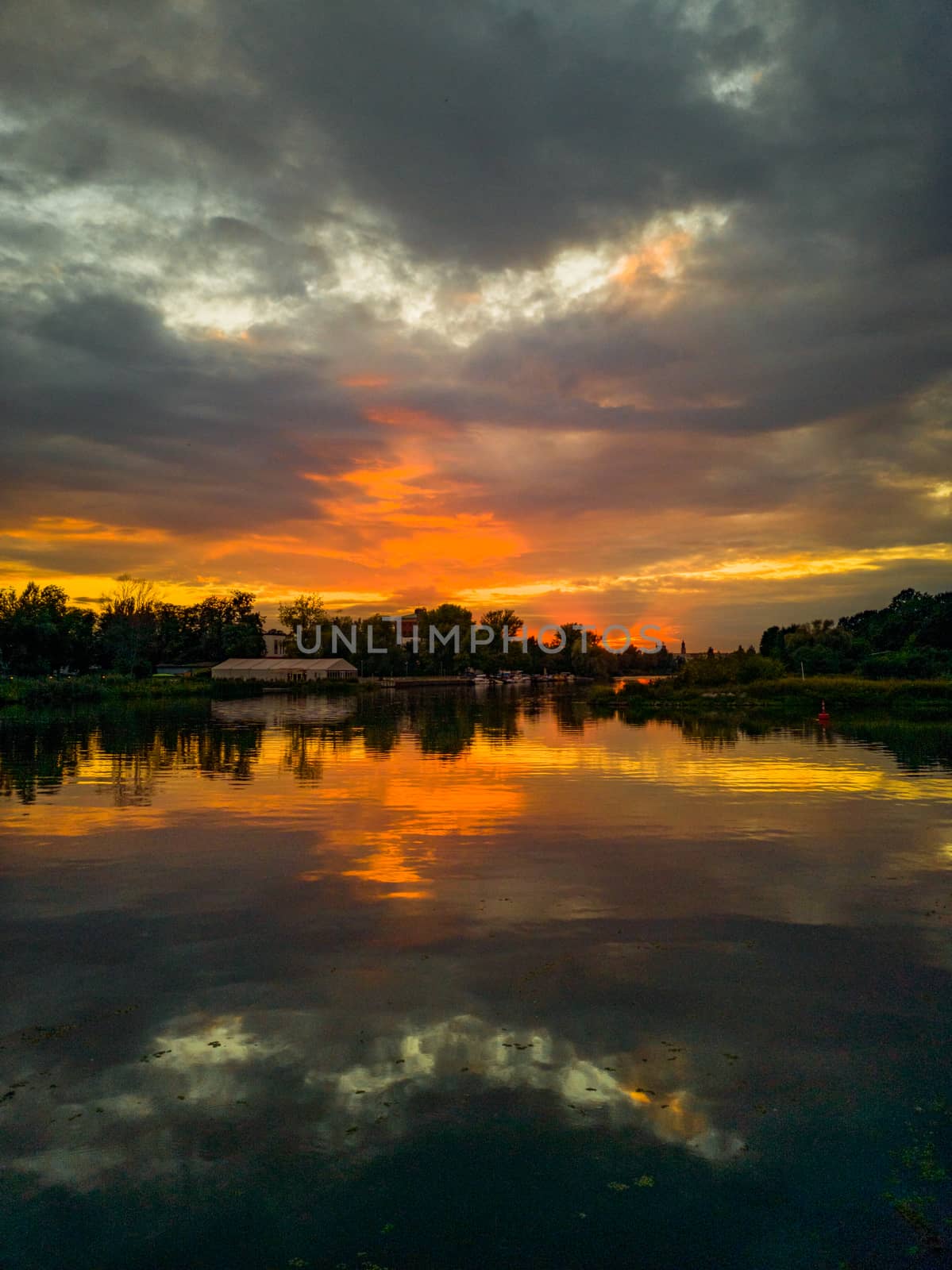 Cloudy sunset reflecting in Odra river by Wierzchu