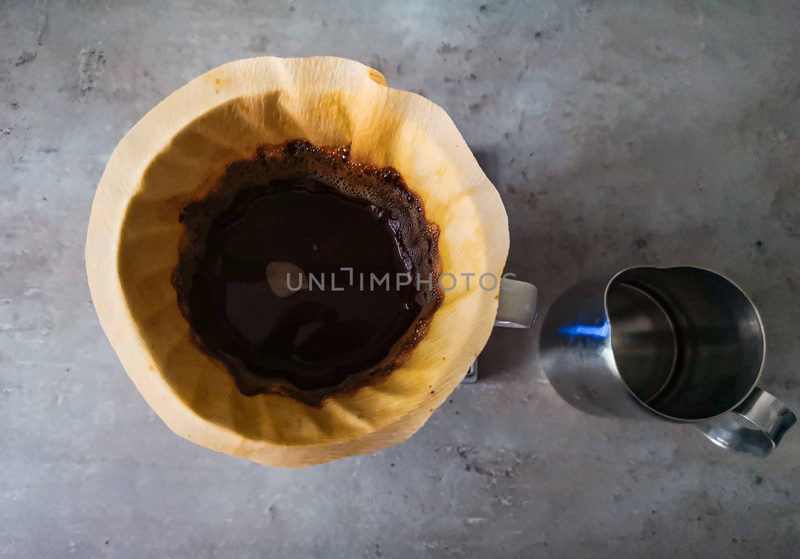 Top down look to dripper with black coffee