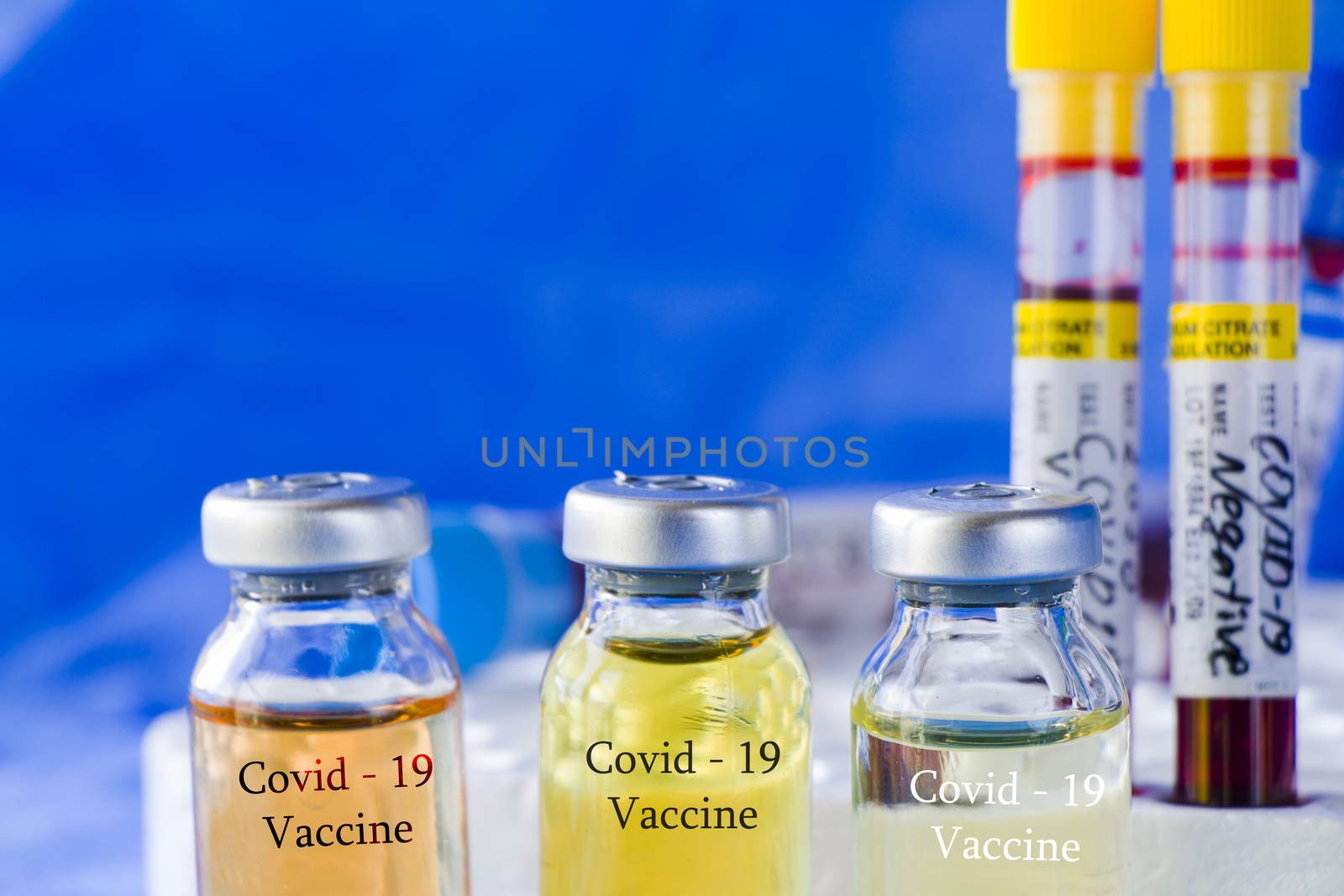 Corona virus and Covid - 19 new vaccine in ampules and blood tube, variations of vaccine by Taidundua